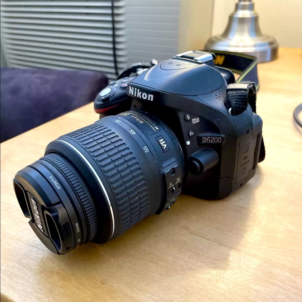 Nikon D5200 with 18-55mm lens, strap and 32GB memory